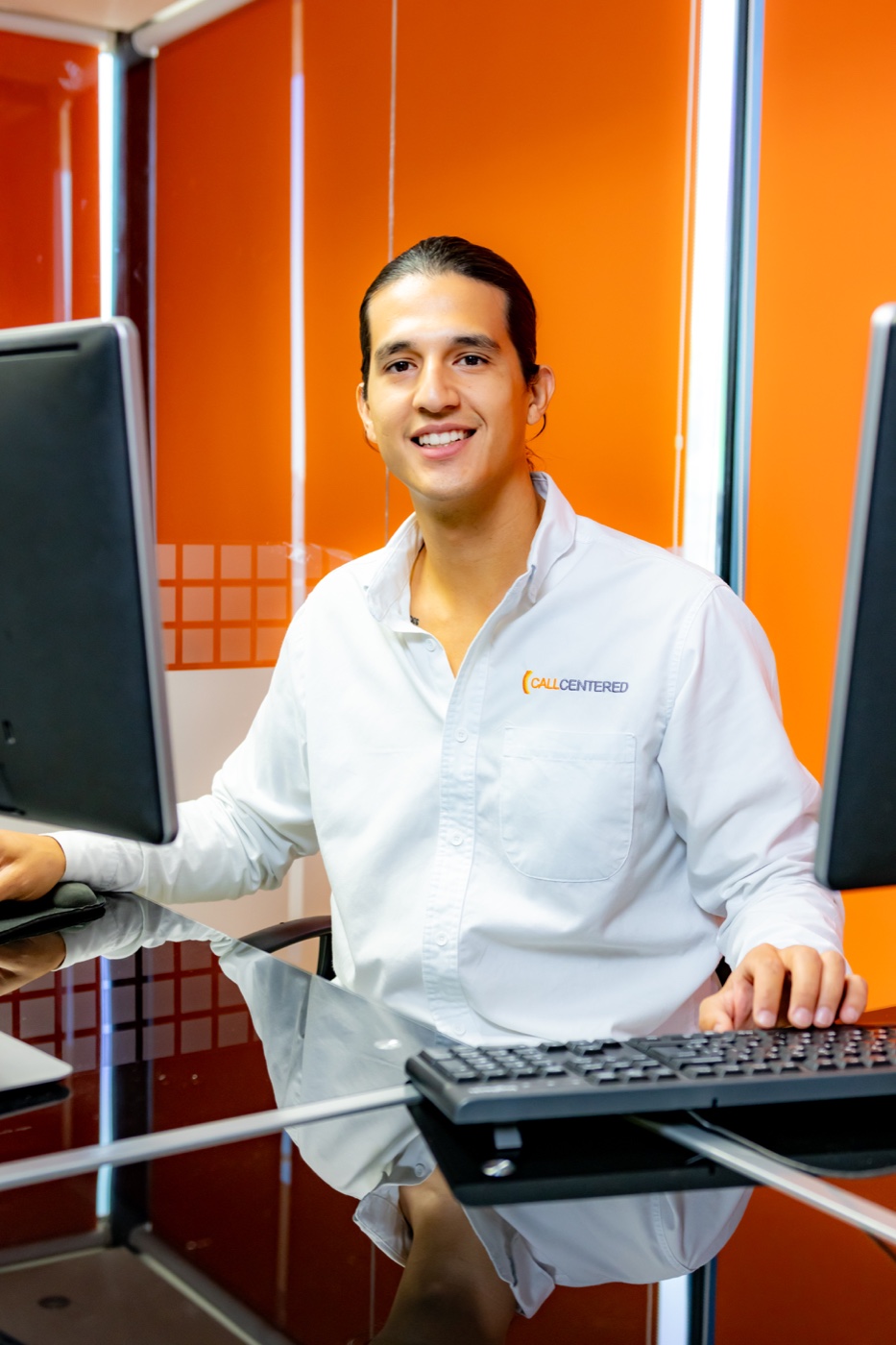 A CallCentered employee at a branded workstation in Hermosillo